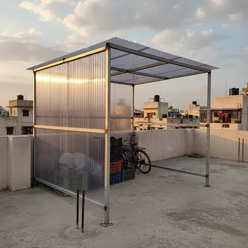 Basic rooftop shed with lightweight steel frame and polycarbonate roofing on terrace for economical storage solution