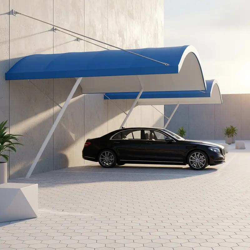 A sleek black sedan parked under a cantilevered car parking shed attached to a wall, featuring a blue-and-white scalloped-edge canopy with a sloping, modern design supported by white metal posts and tensioned cables. The ground is paved with interlocking tiles in an open-air urban setting, providing shade and weather protection in a minimalist environment.